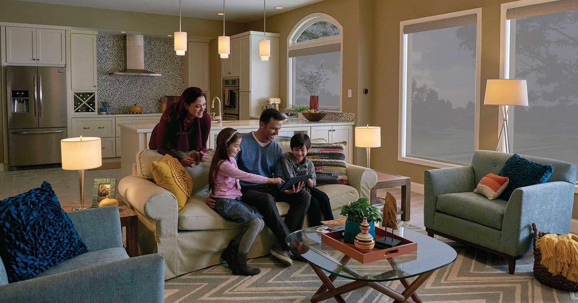 A family spends tome together in their home with warm lighting controlled by Lutron controls